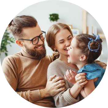 Happy young couple smiling at child
