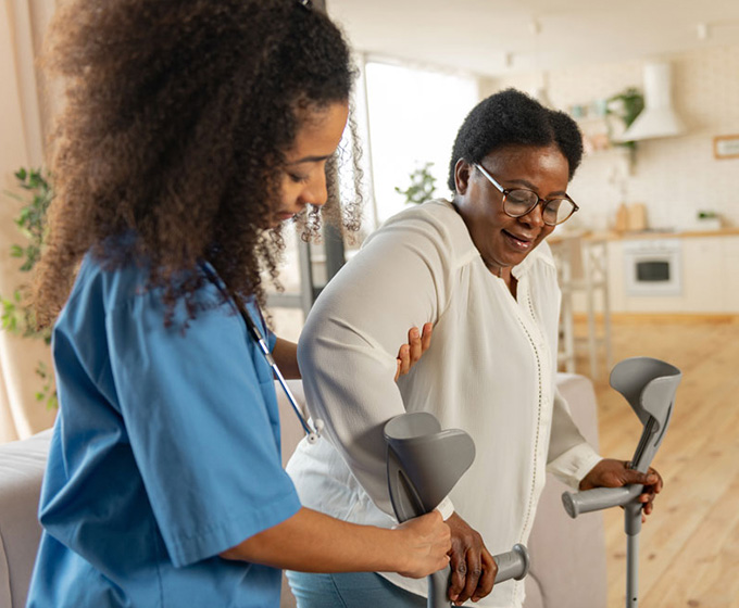 Nurse assisting patient on mobility